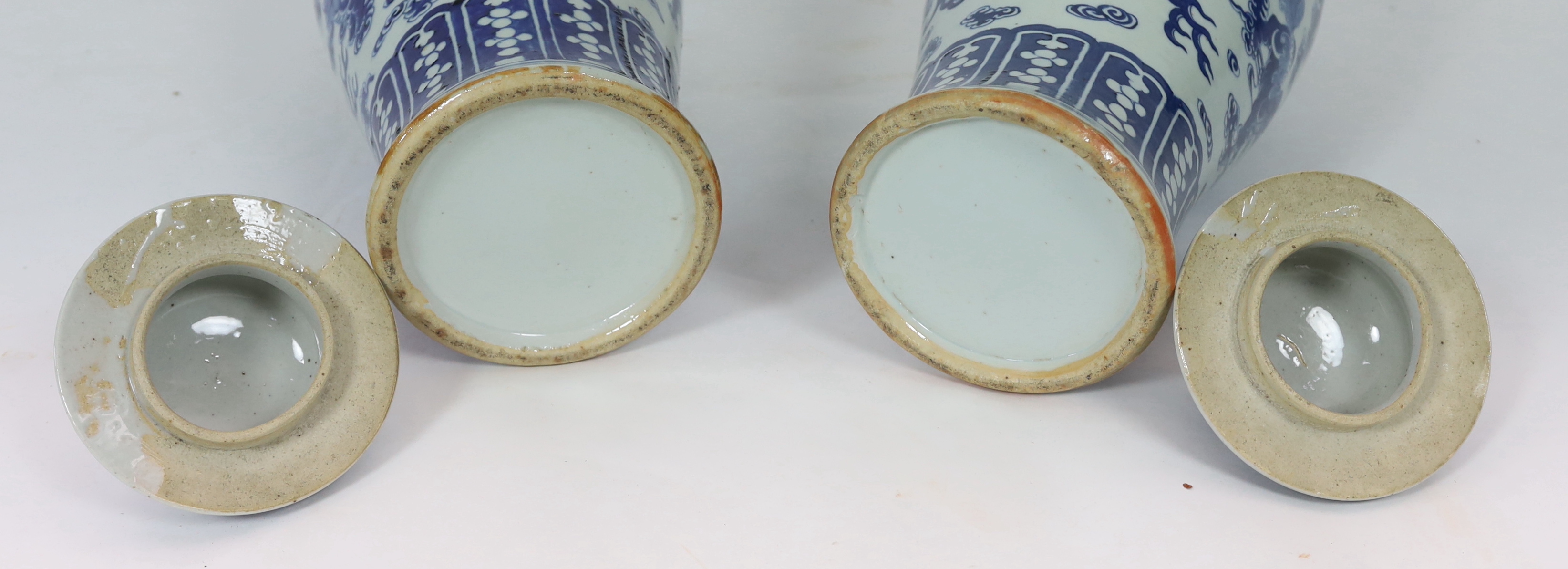 A pair of large Chinese blue and white ‘Buddhist lion’ vases and covers, 19th century, glaze imperfections